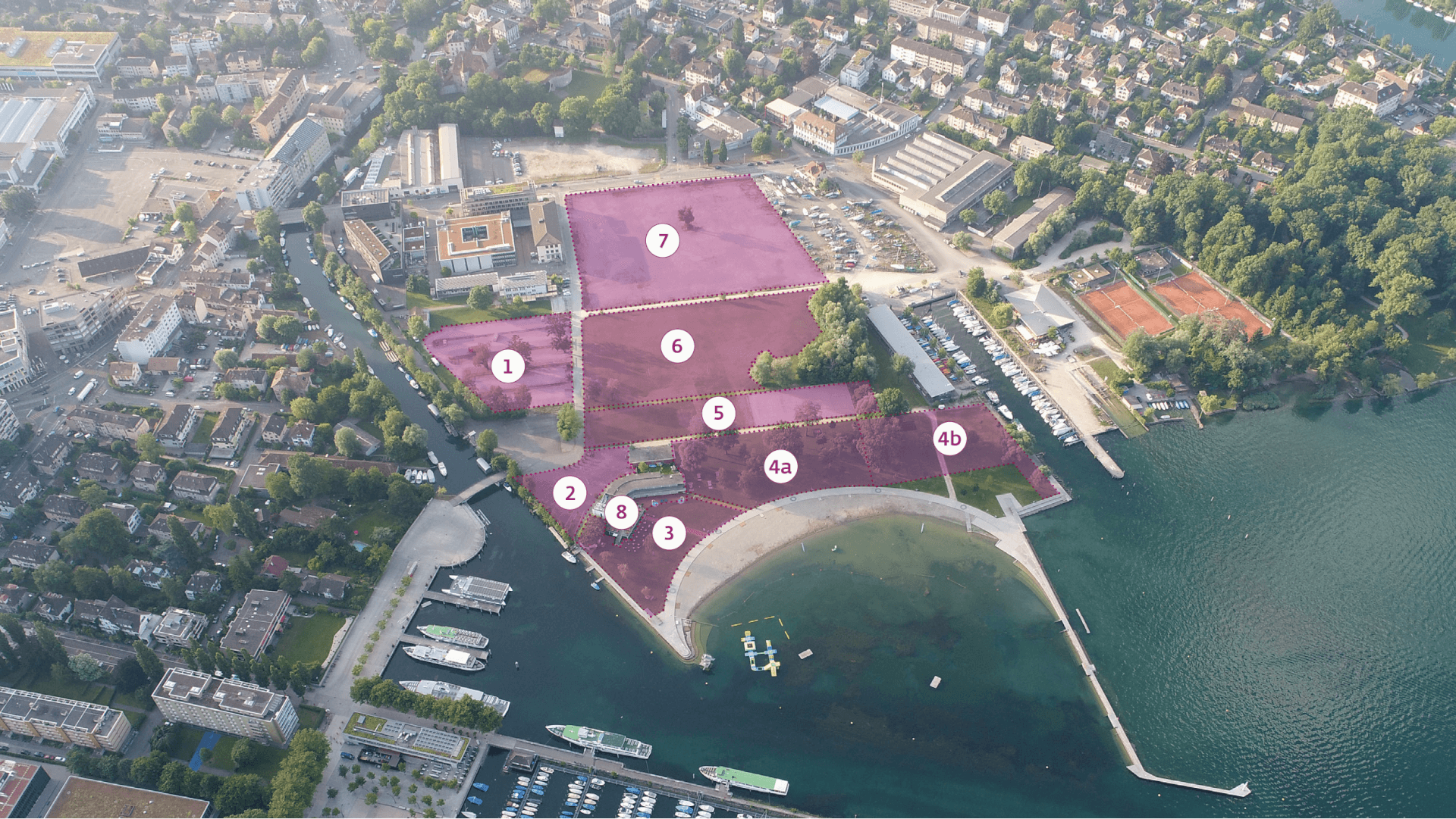 Luftaufnahme eines Hafengebiets mit nummerierten und schattierten Zonen, die mit 1 bis 7 gekennzeichnet sind, mit Anlegestellen, Gebäuden, Bäumen und Wasserzugangspunkten.
